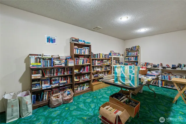 a view of a workspace with furniture and toys