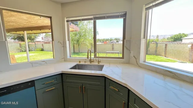 a kitchen with a sink and a window
