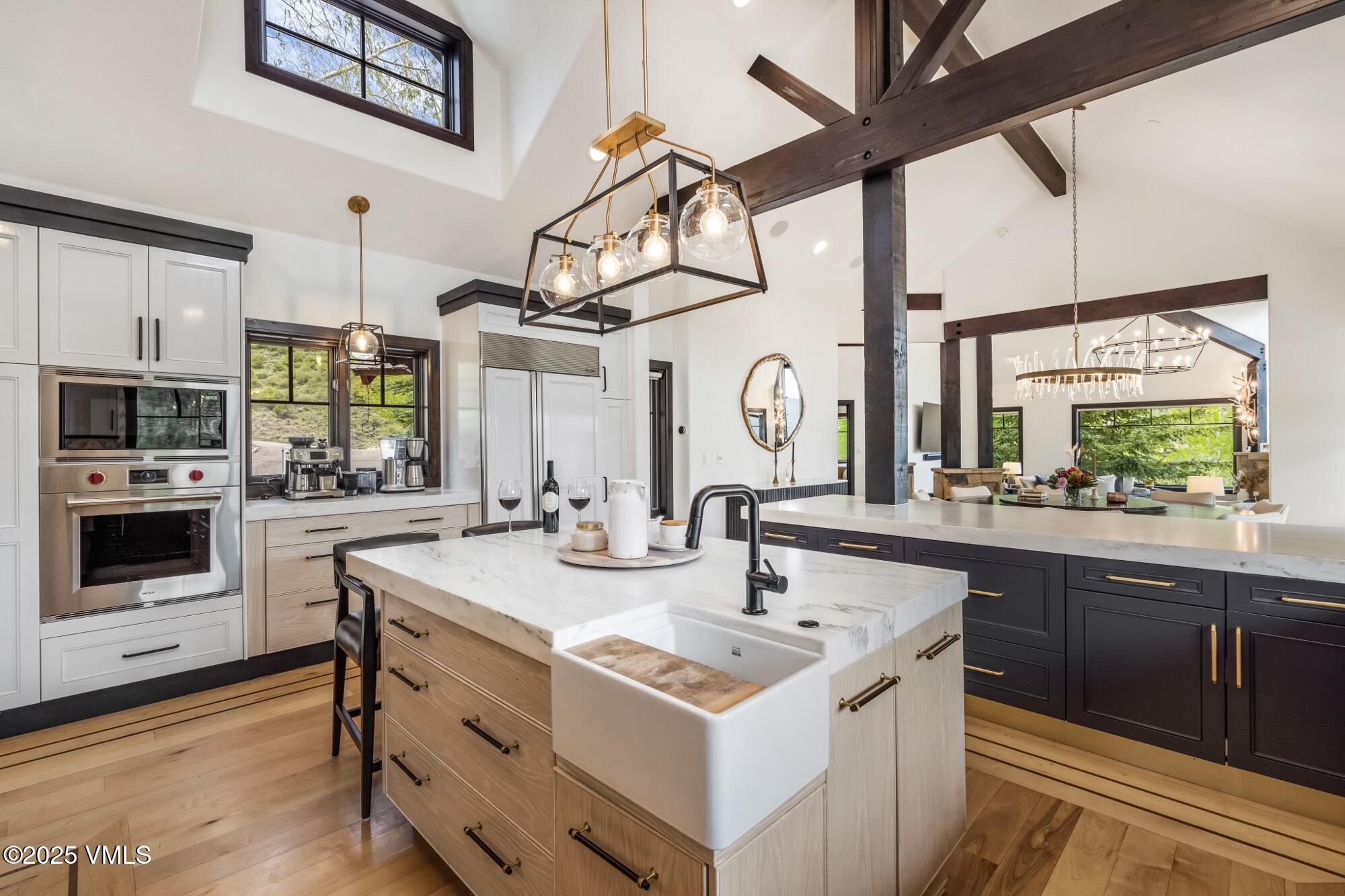 1122 Red Draw Edwards, CO 81632 - Photo 20 of 54 a kitchen with stainless steel appliances a sink a stove top oven a chimney and a window