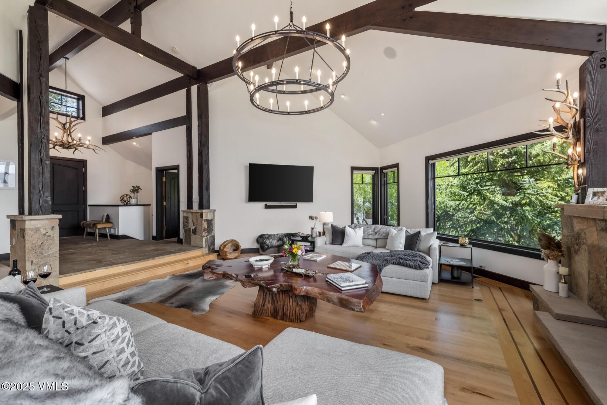 1122 Red Draw Edwards, CO 81632 - Photo 9 of 54 a living room with furniture a large window and a flat tv screen
