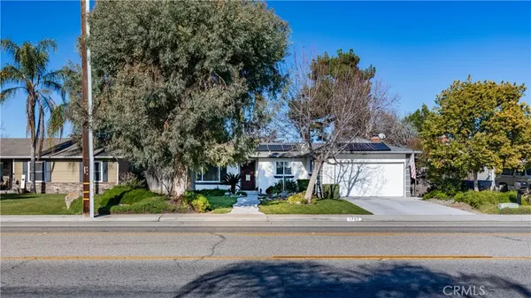 front view of a house with a garden