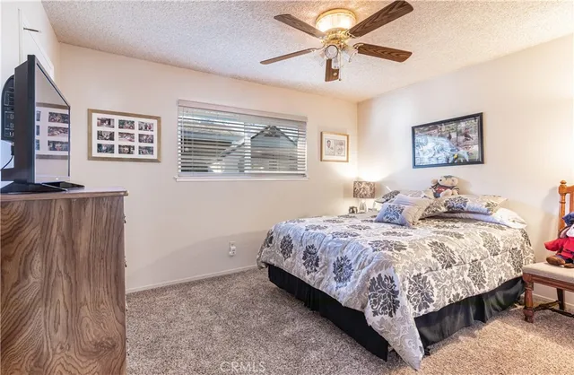 a bedroom with bed and a window