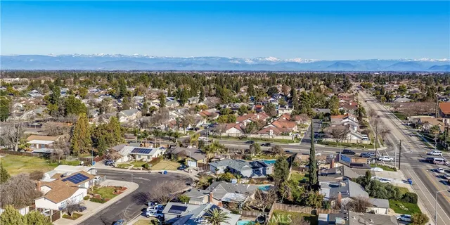 an aerial view of residential building and lake
