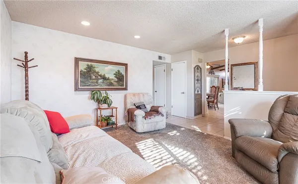 a bedroom with furniture and a chandelier