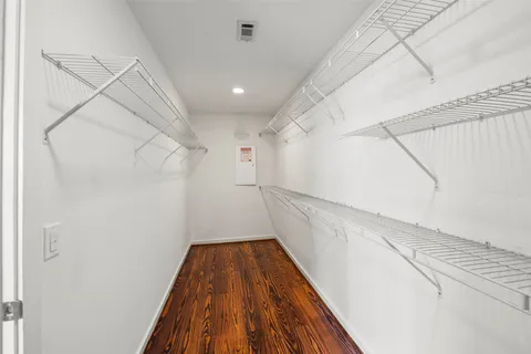 an empty room with windows and entrance