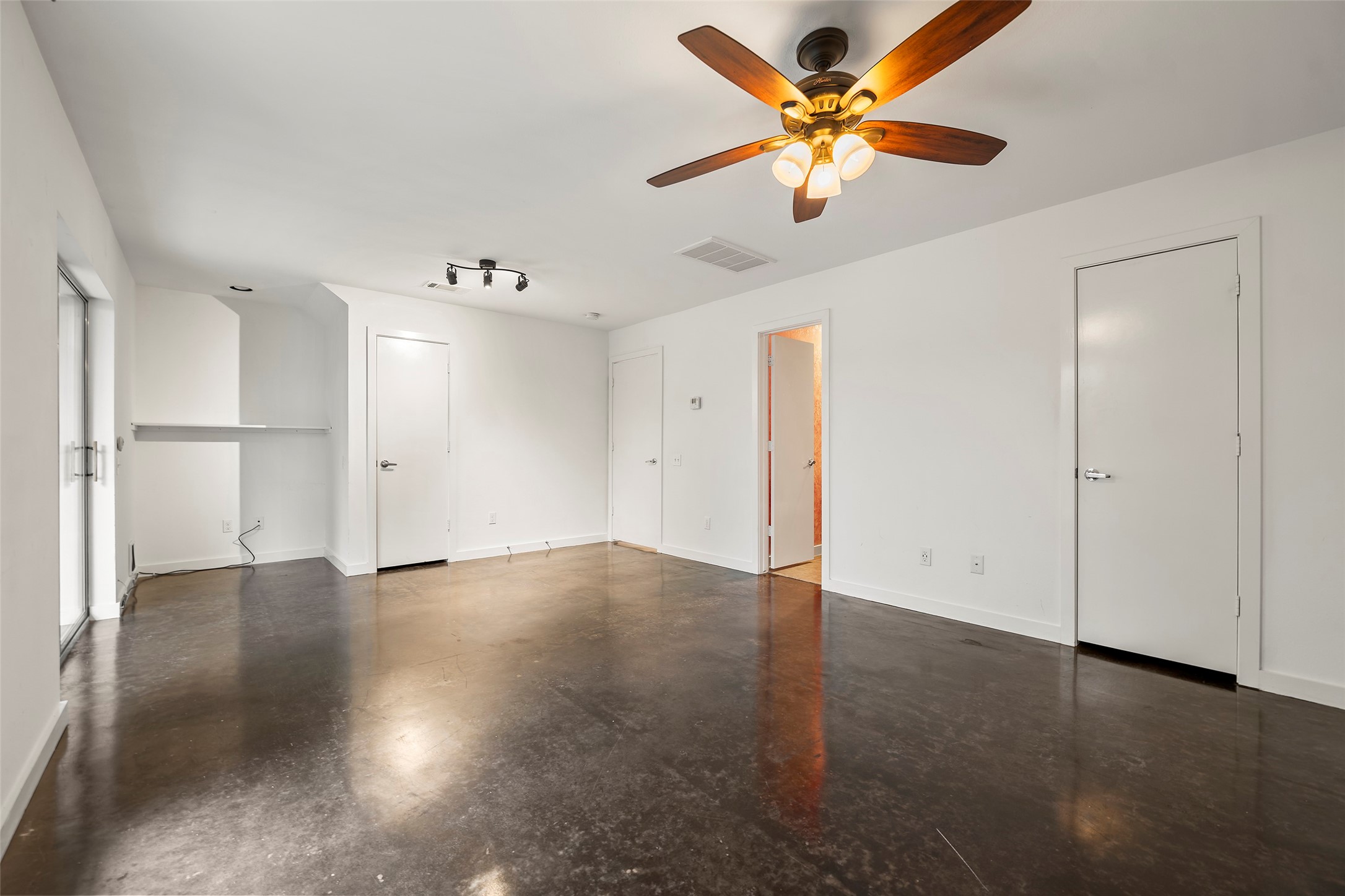 3018 Commerce Street Houston, TX 77003 - Photo 24 of 34 an empty room with wooden floor and a ceiling fan