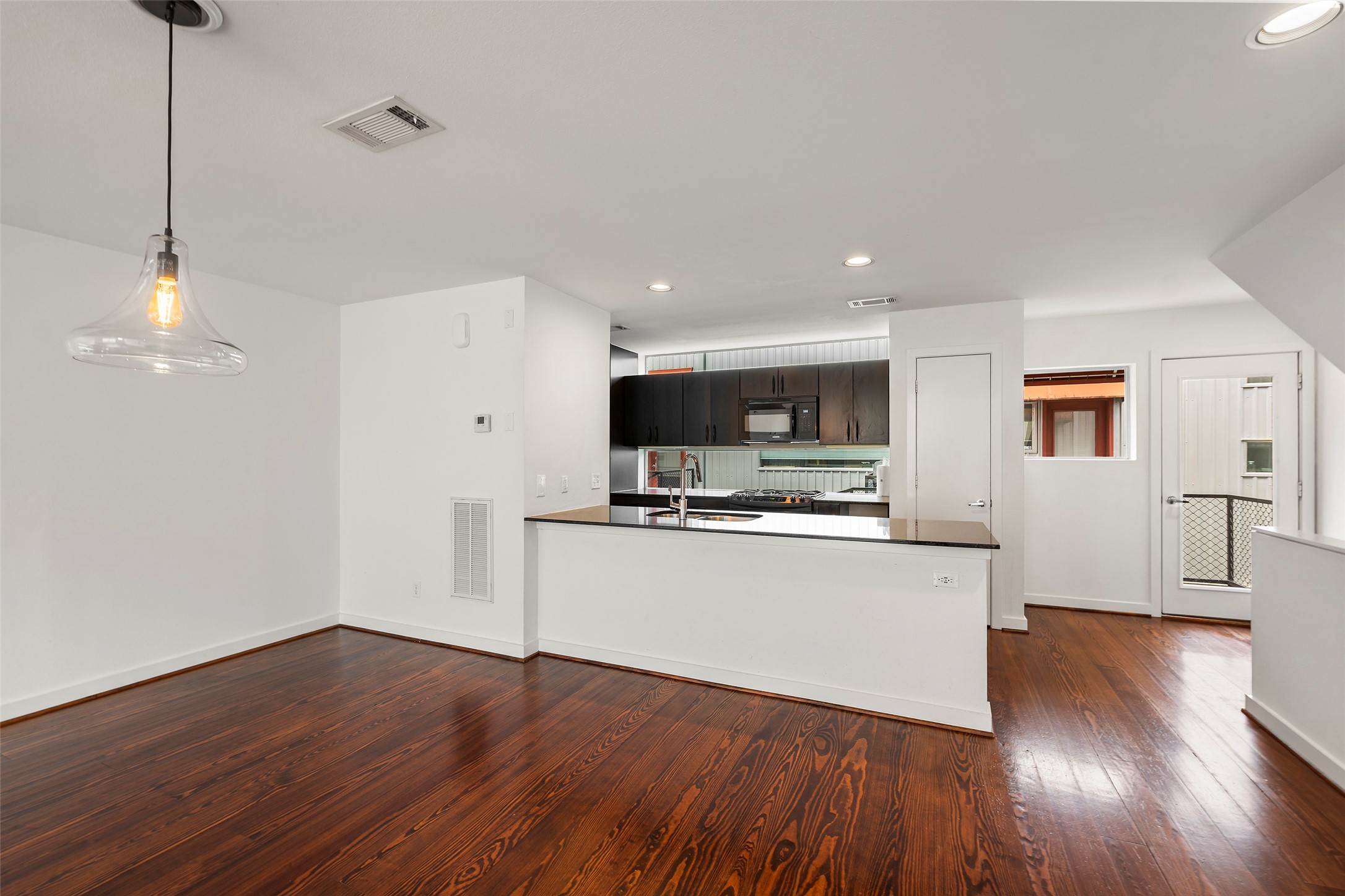 3018 Commerce Street Houston, TX 77003 - Photo 5 of 34 a view of kitchen with wooden floor and electronic appliances