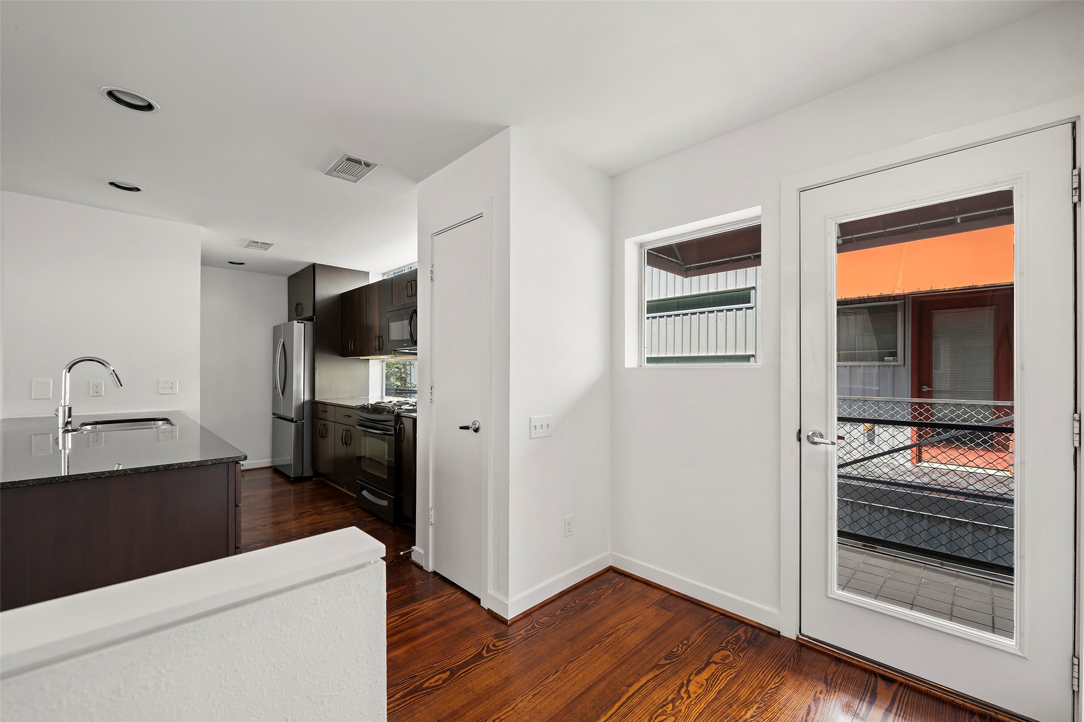 3018 Commerce Street Houston, TX 77003 - Photo 6 of 34 a kitchen with a refrigerator and a sink