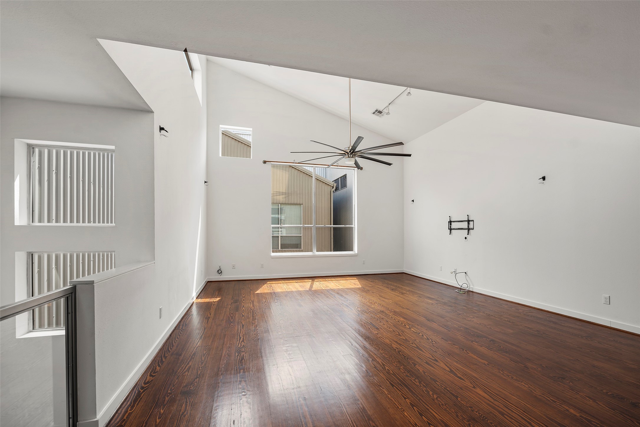 3018 Commerce Street Houston, TX 77003 - Photo 8 of 34 a view of an empty room with wooden floor and a window