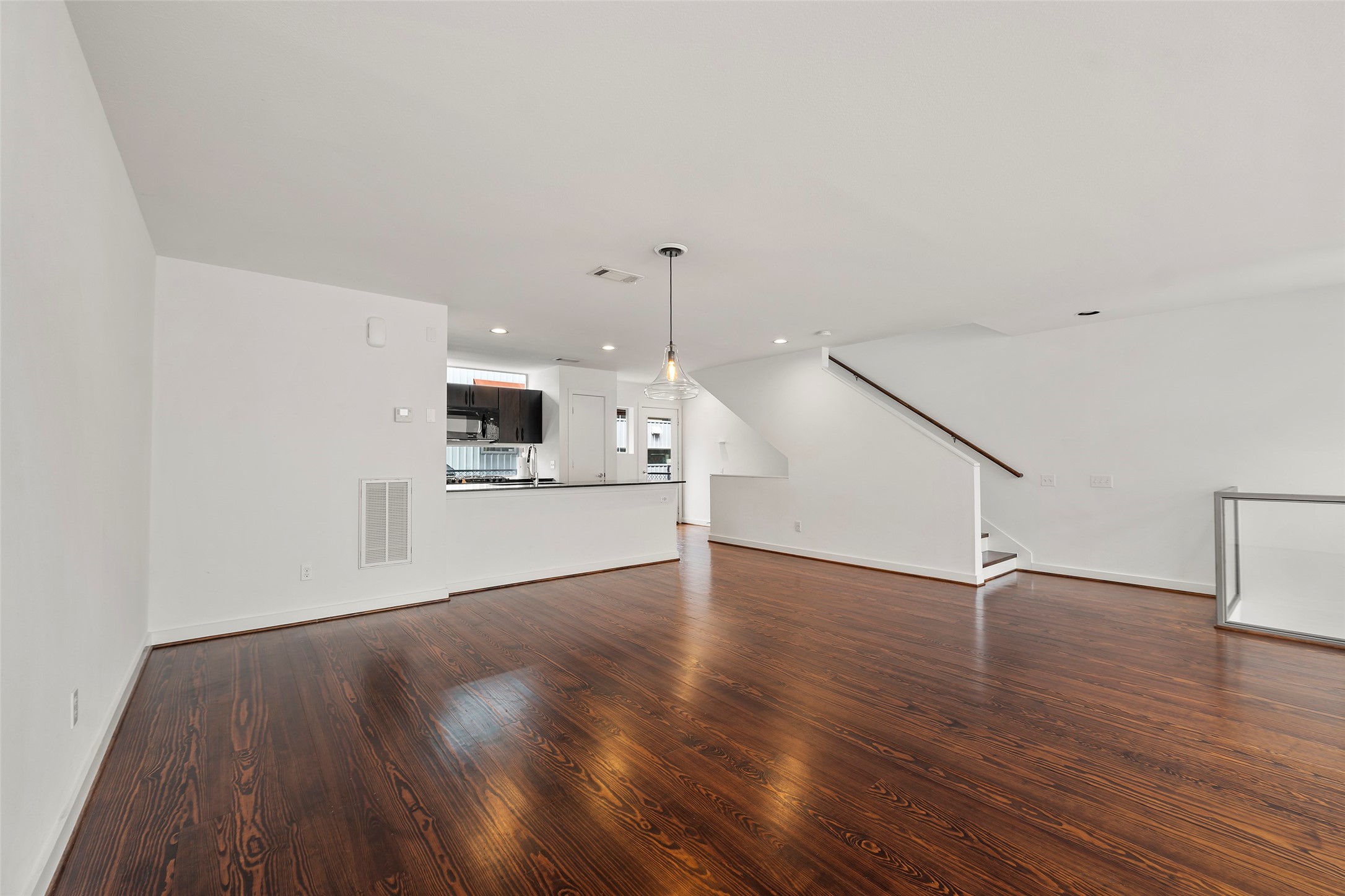 3018 Commerce Street Houston, TX 77003 - Photo 9 of 34 a view of a kitchen with wooden floor and electronic appliances