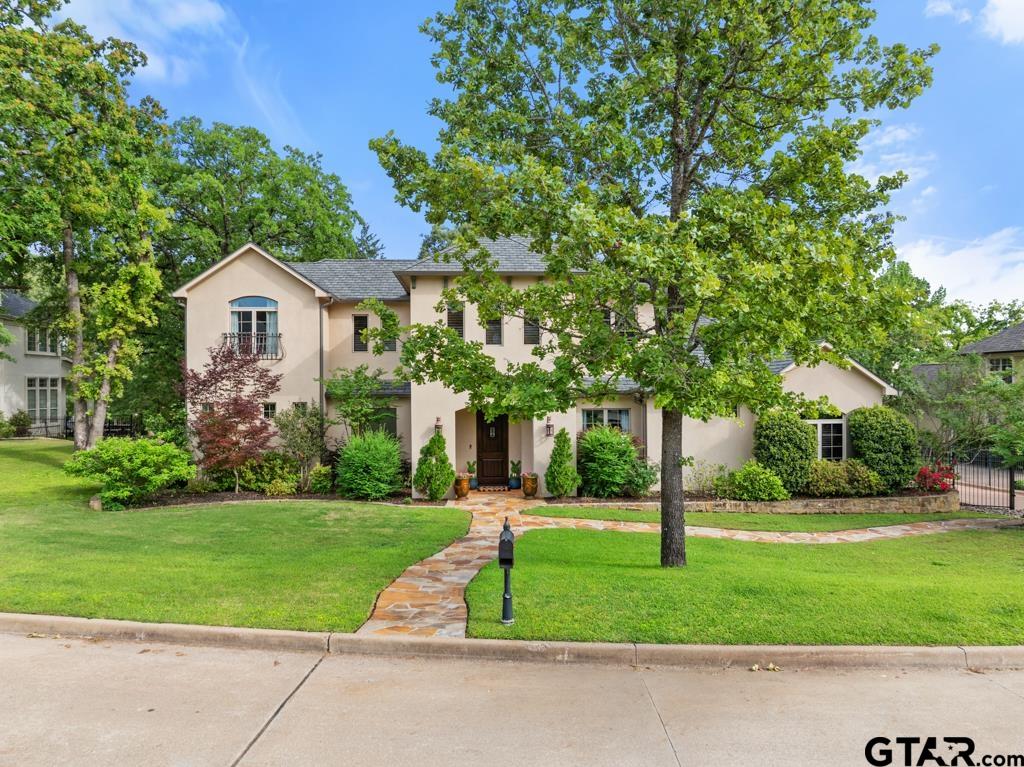 2907 Stewart Way Tyler, TX 75709 - Photo 1 of 45 a front view of a house with a yard and trees