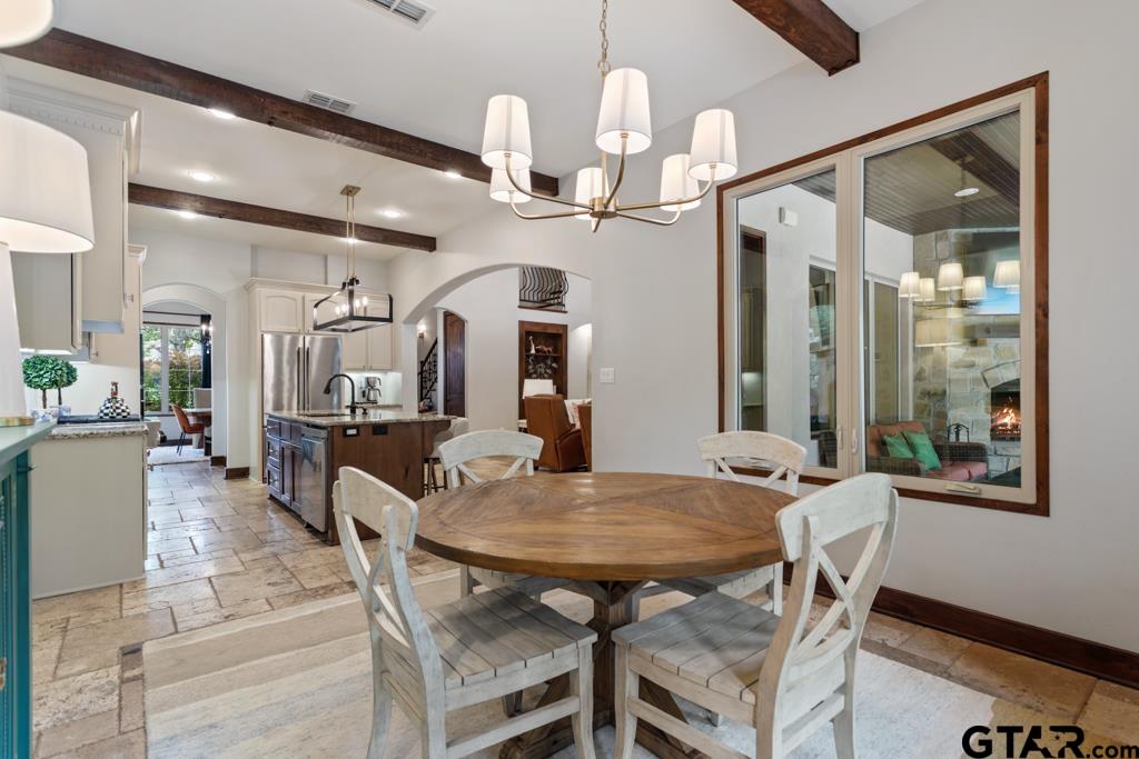 2907 Stewart Way Tyler, TX 75709 - Photo 12 of 45 a view of a dining room with furniture and wooden floor