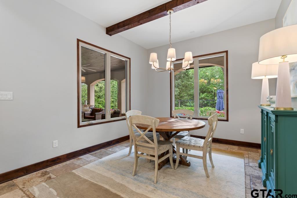 2907 Stewart Way Tyler, TX 75709 - Photo 13 of 45 a dining room with furniture a chandelier and wooden floor