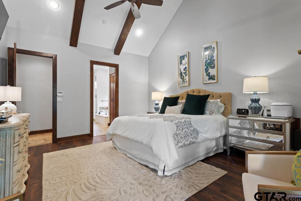 2907 Stewart Way Tyler, TX 75709 - Photo 18 of 45 a bedroom with a bed and a chair with the wooden floor