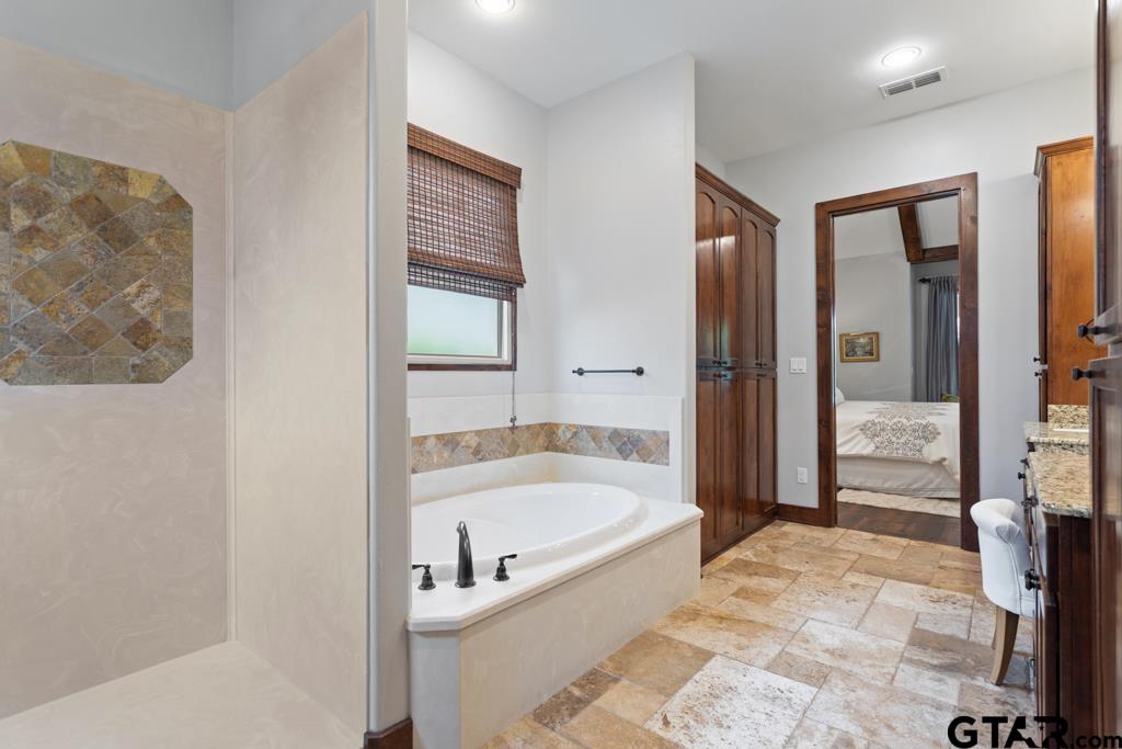 2907 Stewart Way Tyler, TX 75709 - Photo 20 of 45 a bathroom with a tub and shower