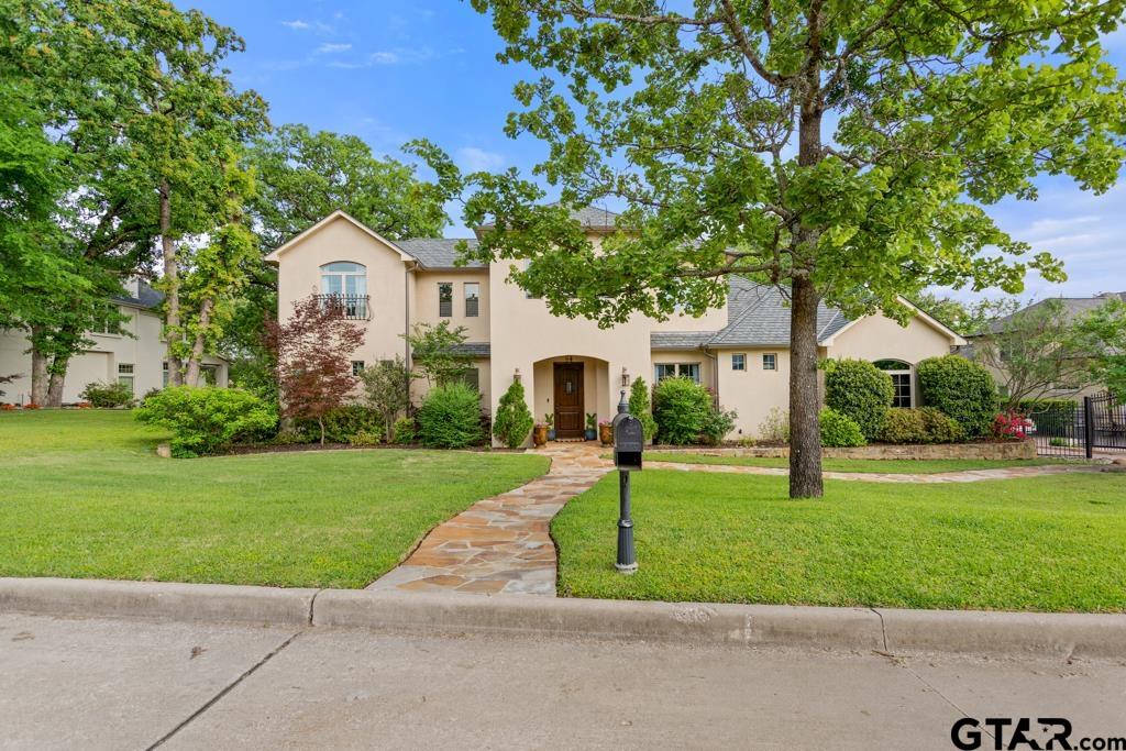 2907 Stewart Way Tyler, TX 75709 - Photo 2 of 45 a front view of a house with garden