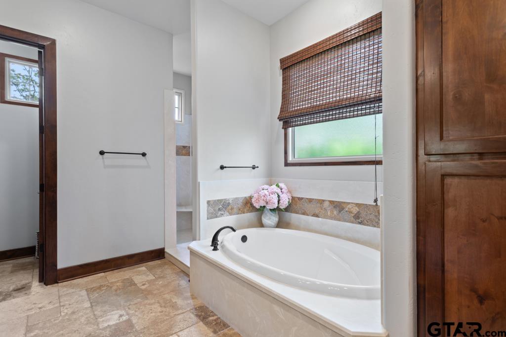 2907 Stewart Way Tyler, TX 75709 - Photo 21 of 45 a white bath tub sitting next to a window
