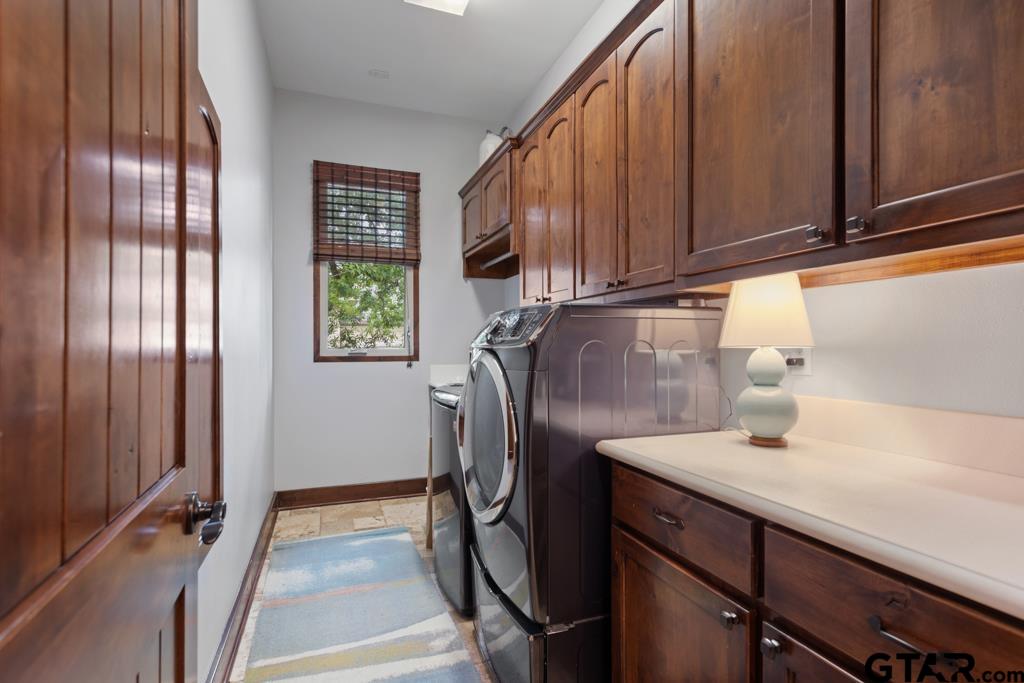 2907 Stewart Way Tyler, TX 75709 - Photo 22 of 45 a bathroom with a sink a mirror and shower