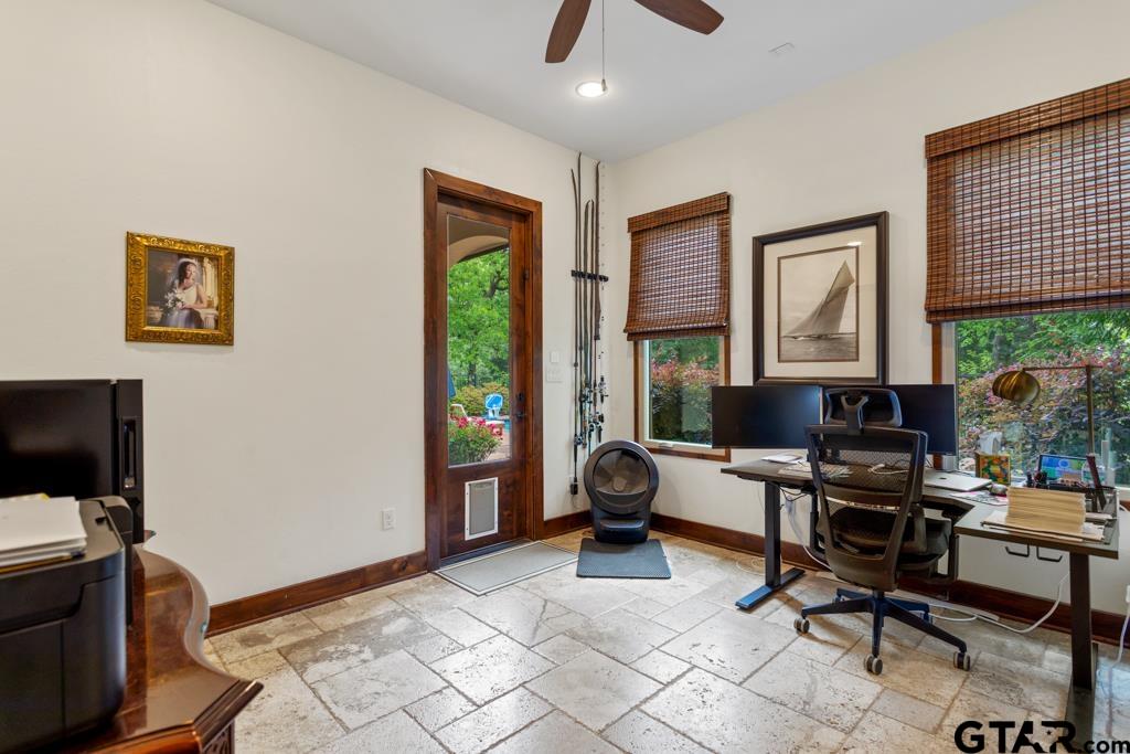 2907 Stewart Way Tyler, TX 75709 - Photo 24 of 45 a view of a workspace with furniture and a window