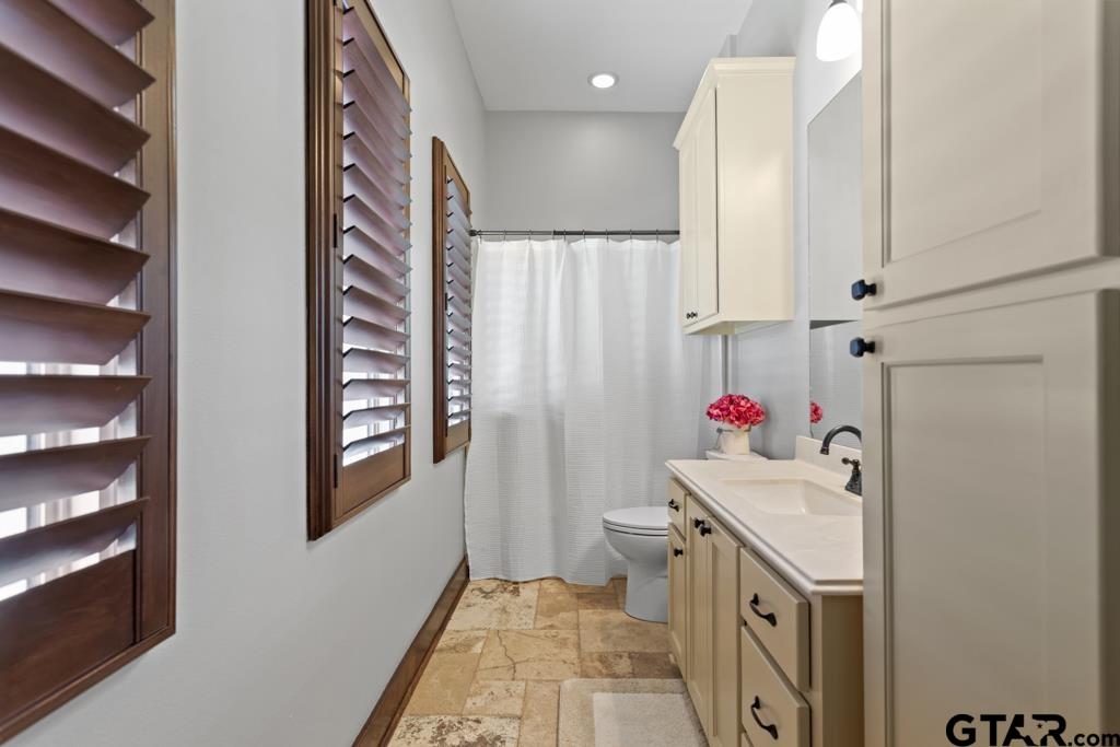2907 Stewart Way Tyler, TX 75709 - Photo 27 of 45 a bathroom with a sink toilet and shower