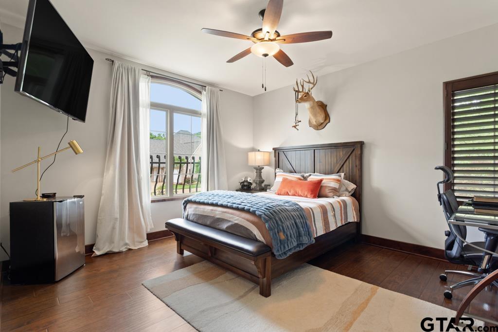 2907 Stewart Way Tyler, TX 75709 - Photo 28 of 45 a bed room with a bed window and a flat screen tv