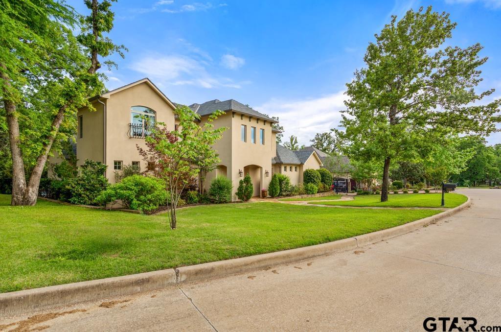 2907 Stewart Way Tyler, TX 75709 - Photo 3 of 45 a view of a house with a yard and large trees