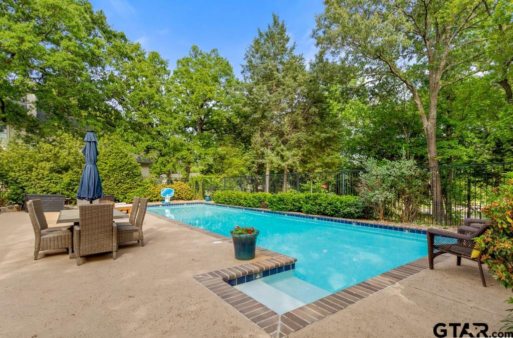 2907 Stewart Way Tyler, TX 75709 - Photo 35 of 45 a backyard of a house with table and chairs
