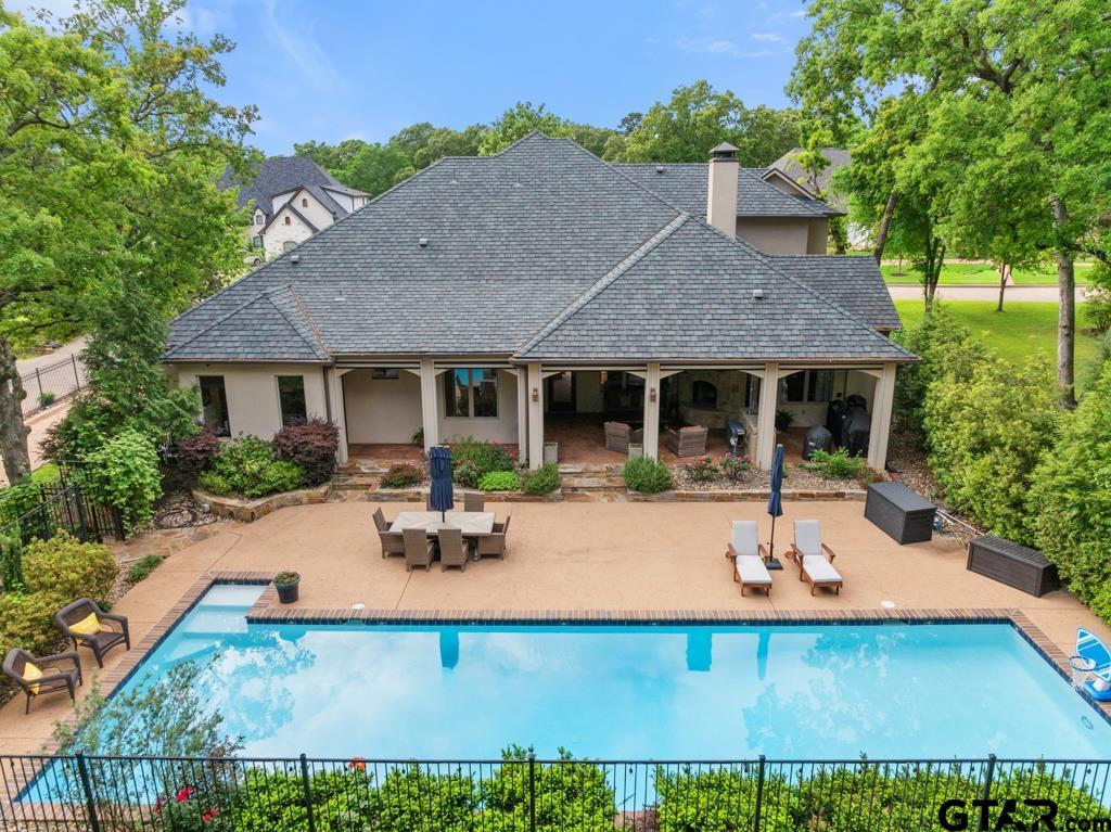 2907 Stewart Way Tyler, TX 75709 - Photo 39 of 45 a view of a house with backyard sitting area and garden