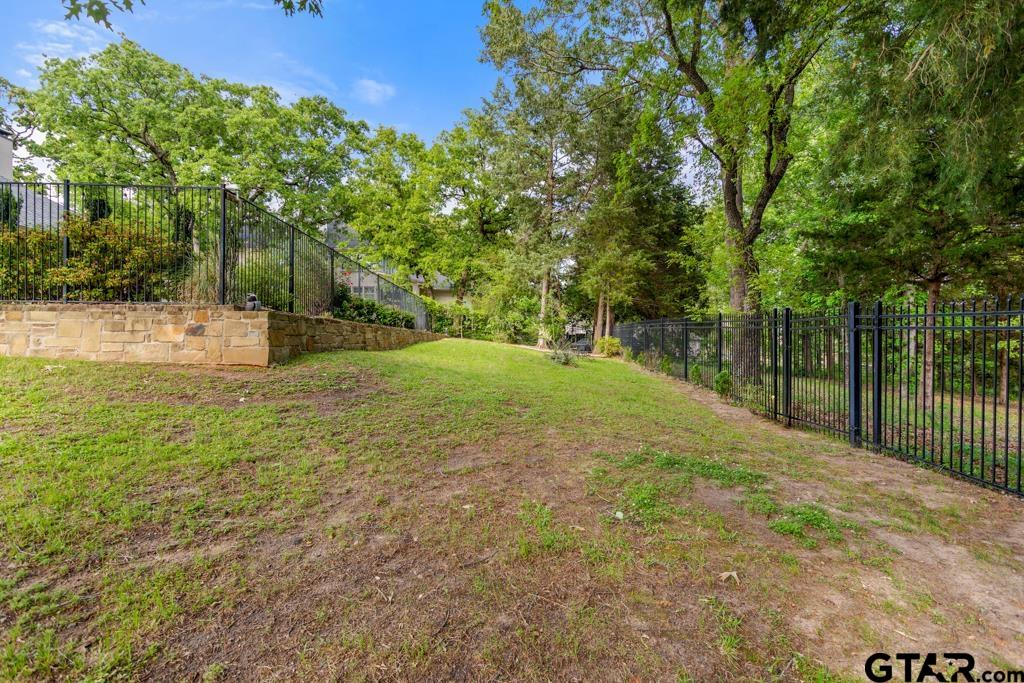 2907 Stewart Way Tyler, TX 75709 - Photo 44 of 45 a view of a field with trees in the background