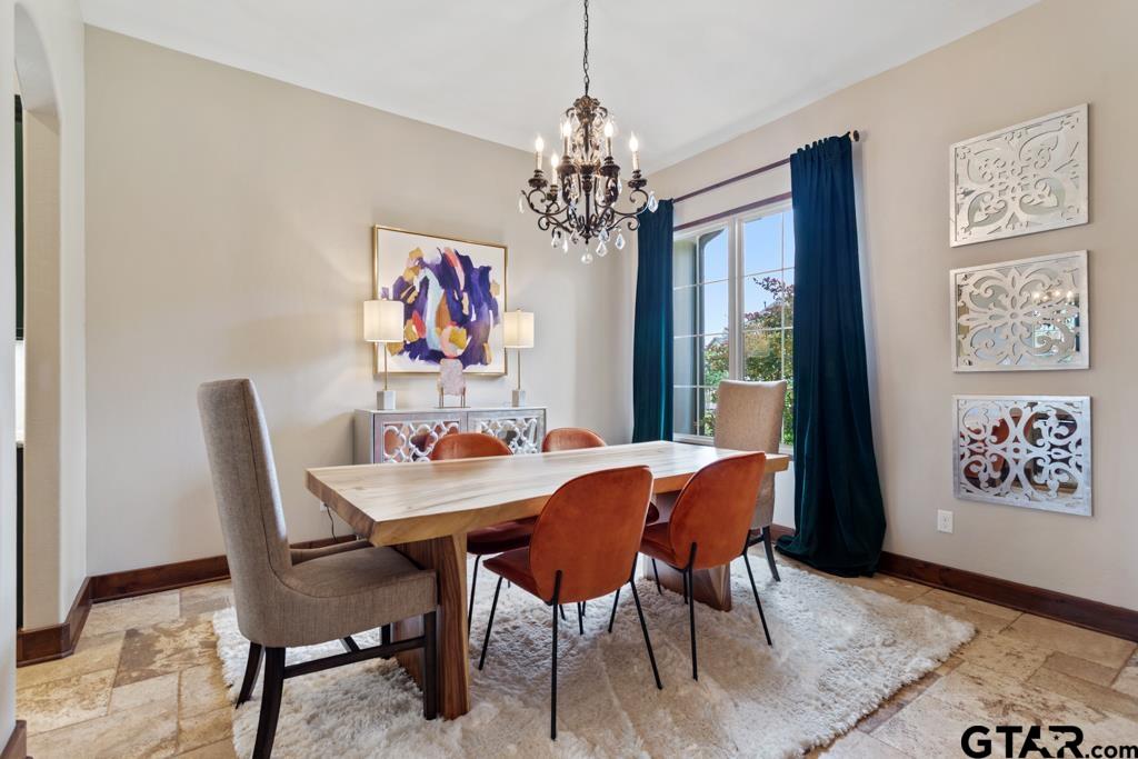 2907 Stewart Way Tyler, TX 75709 - Photo 6 of 45 a view of a dining room with furniture and chandelier