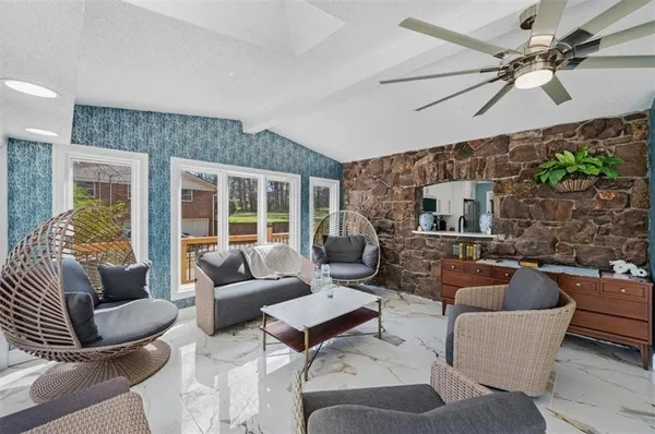 a living room with furniture and a large window