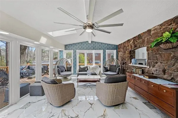 a large white kitchen with cabinets