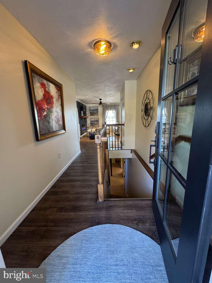 244 Anchor Road Elizabethtown, PA 17022 - Photo 4 of 42 a view of a hallway with wooden floor and staircase
