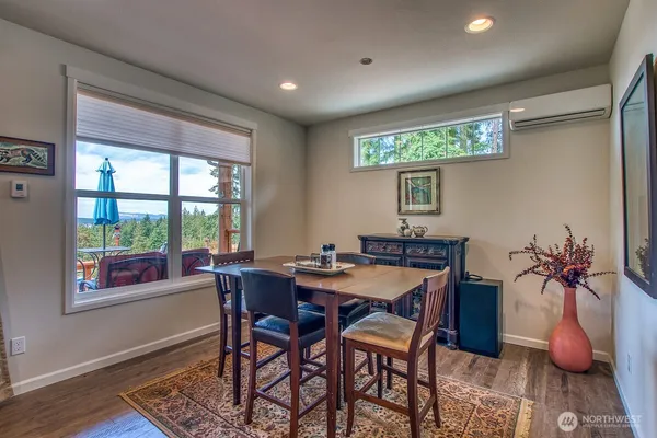 a dining room with furniture and window