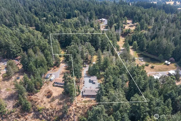 an aerial view of residential house with outdoor space
