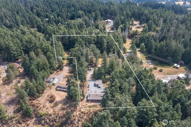 an aerial view of residential house with outdoor space