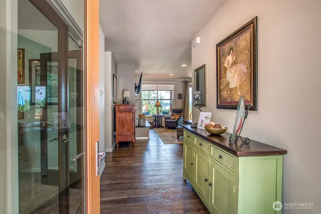 a kitchen with counter top space and wooden floor
