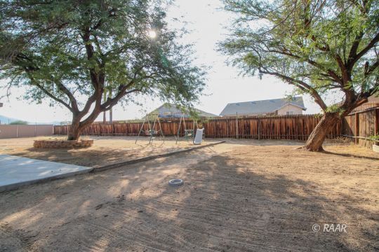 1645 Porter Street Ridgecrest, CA 93555 - Photo 33 of 35 a view of a yard with a house