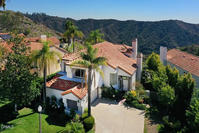 an aerial view of a house with a garden