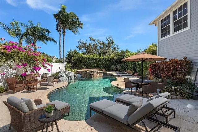 a view of a backyard with sitting area and furniture