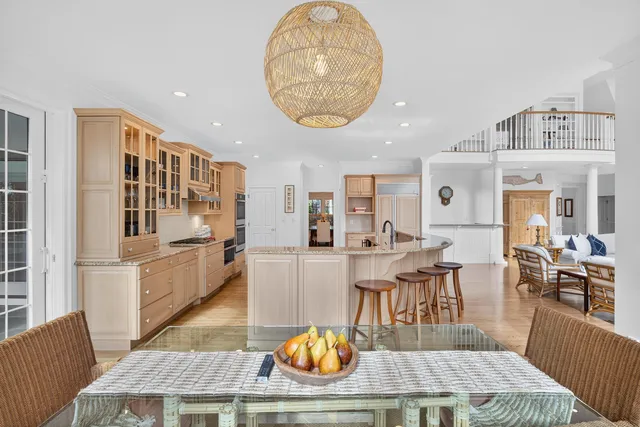 a kitchen with a stove and white cabinets