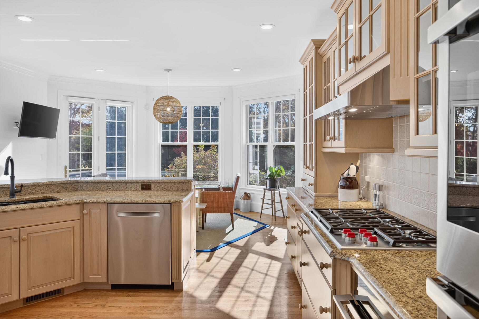 405 Bridge Street Osterville, MA 02655 - Photo 15 of 57 a kitchen with a stove and white cabinets