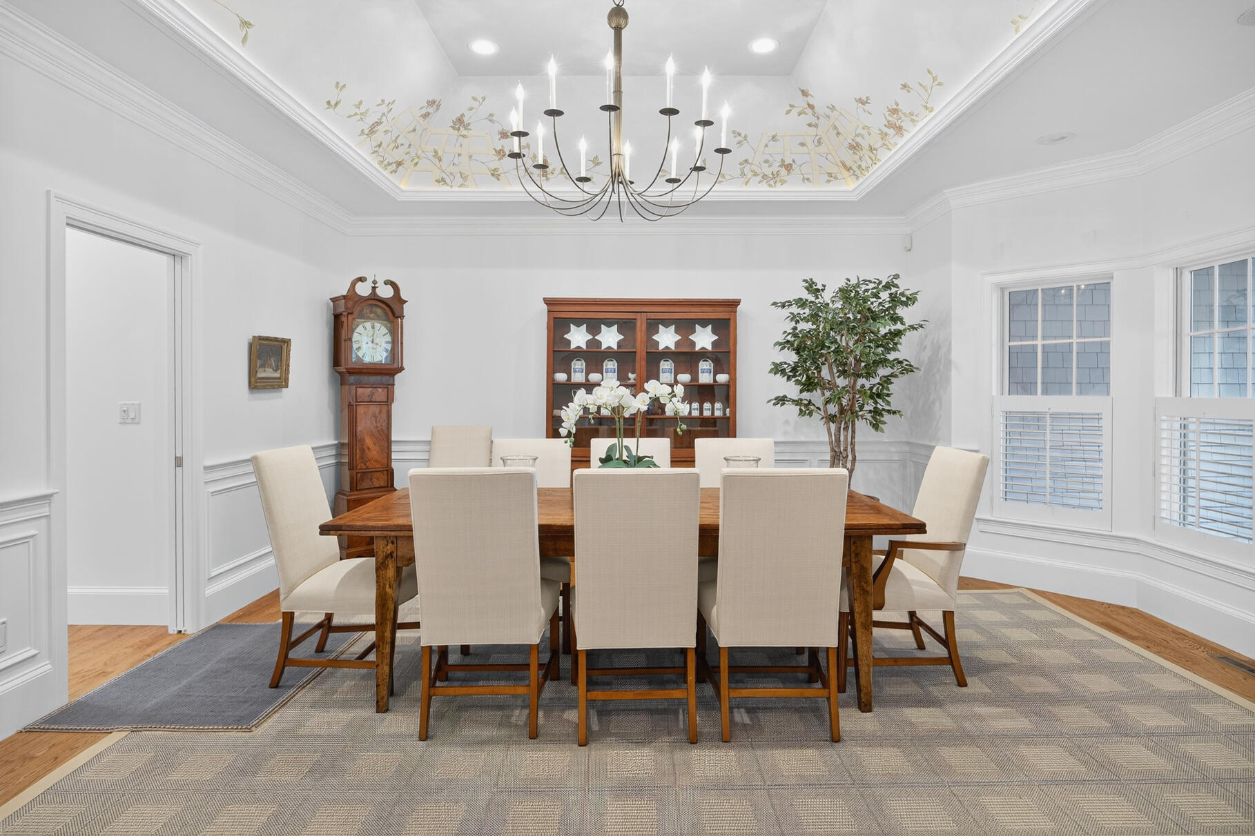 405 Bridge Street Osterville, MA 02655 - Photo 20 of 57 a view of a dining room with furniture a chandelier and wooden floor