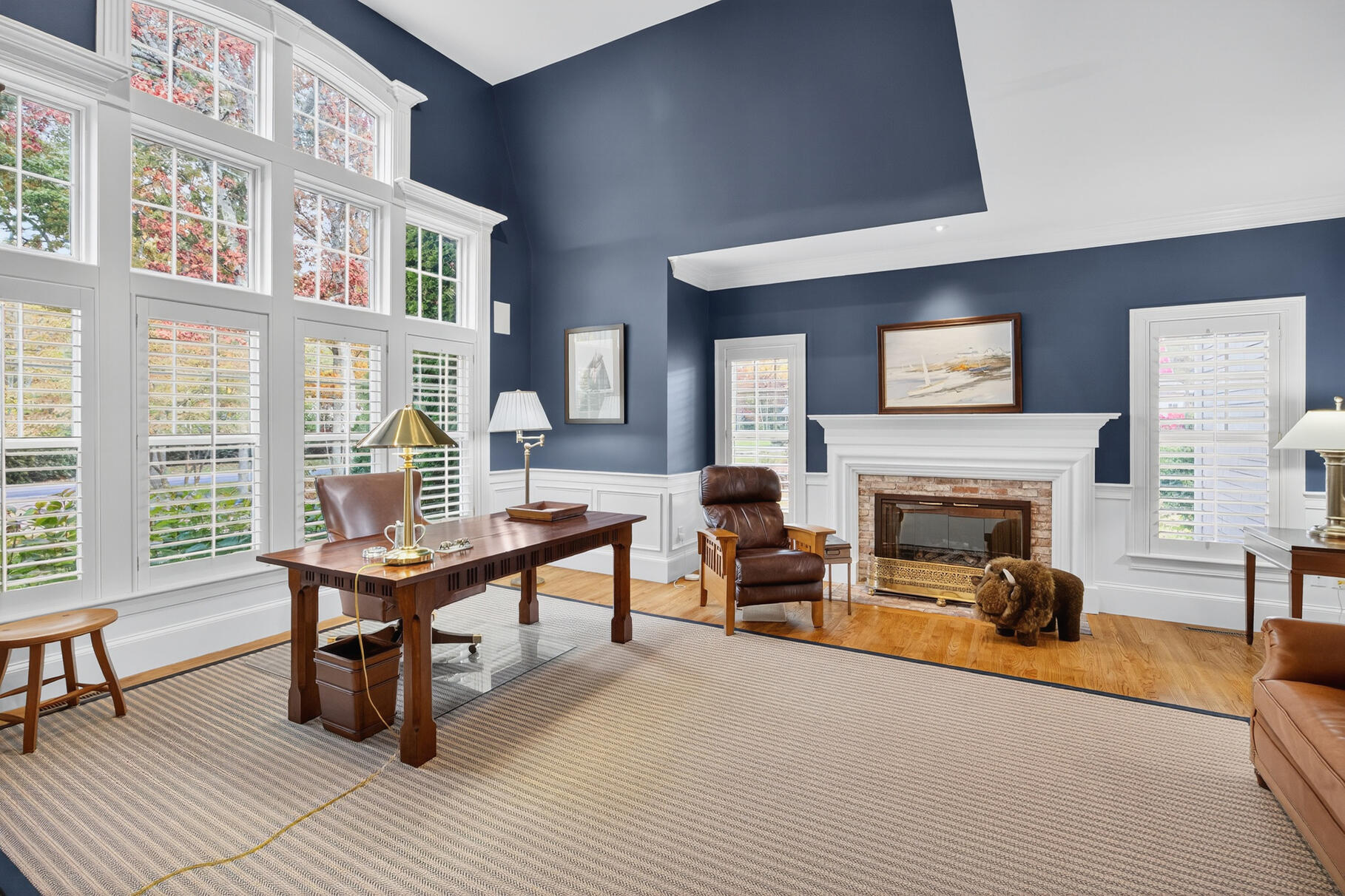 405 Bridge Street Osterville, MA 02655 - Photo 28 of 57 a living room with furniture a fireplace and large windows