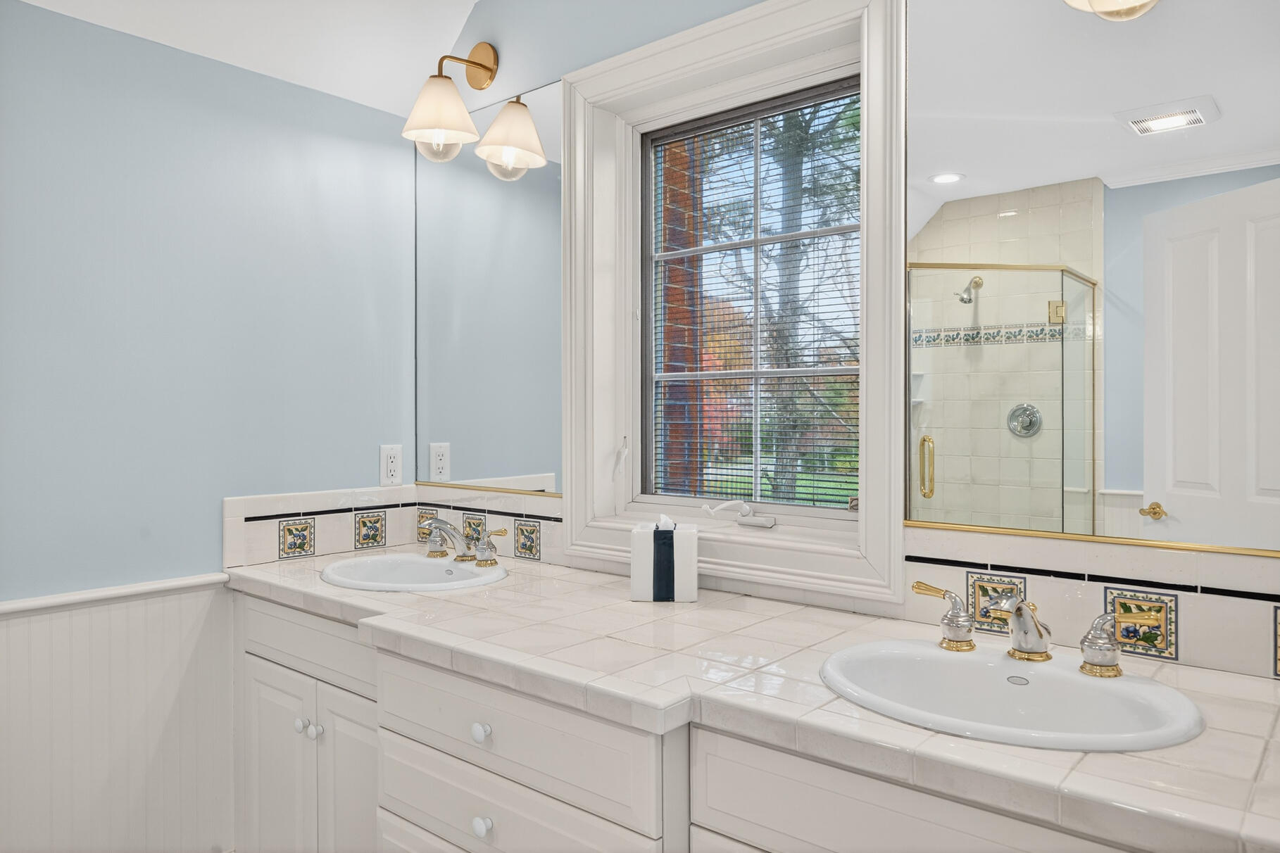 405 Bridge Street Osterville, MA 02655 - Photo 39 of 57 a bathroom with a sink and a mirror