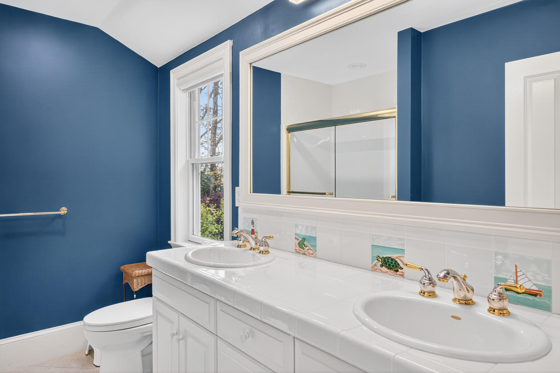 405 Bridge Street Osterville, MA 02655 - Photo 47 of 57 a bathroom with a sink a toilet and a mirror