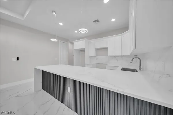 an empty room with white walls