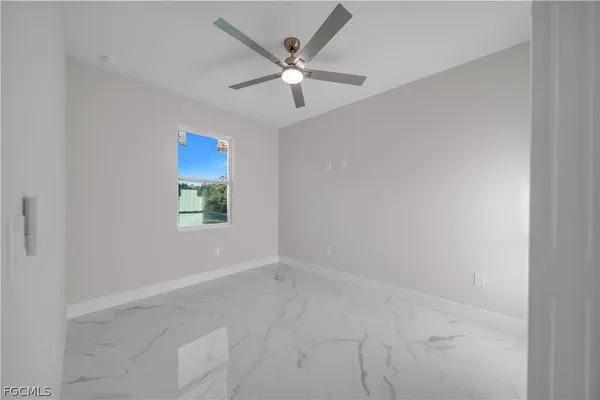 a view of a kitchen with white cabinets