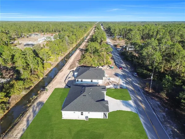 an aerial view of a house with outdoor space