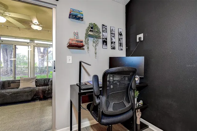 a view of workspace with furniture and natural light